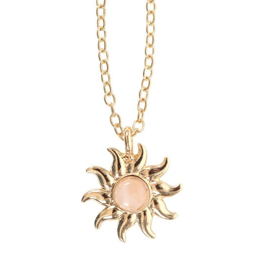 A necklace With celestial, sun and tarot vibes